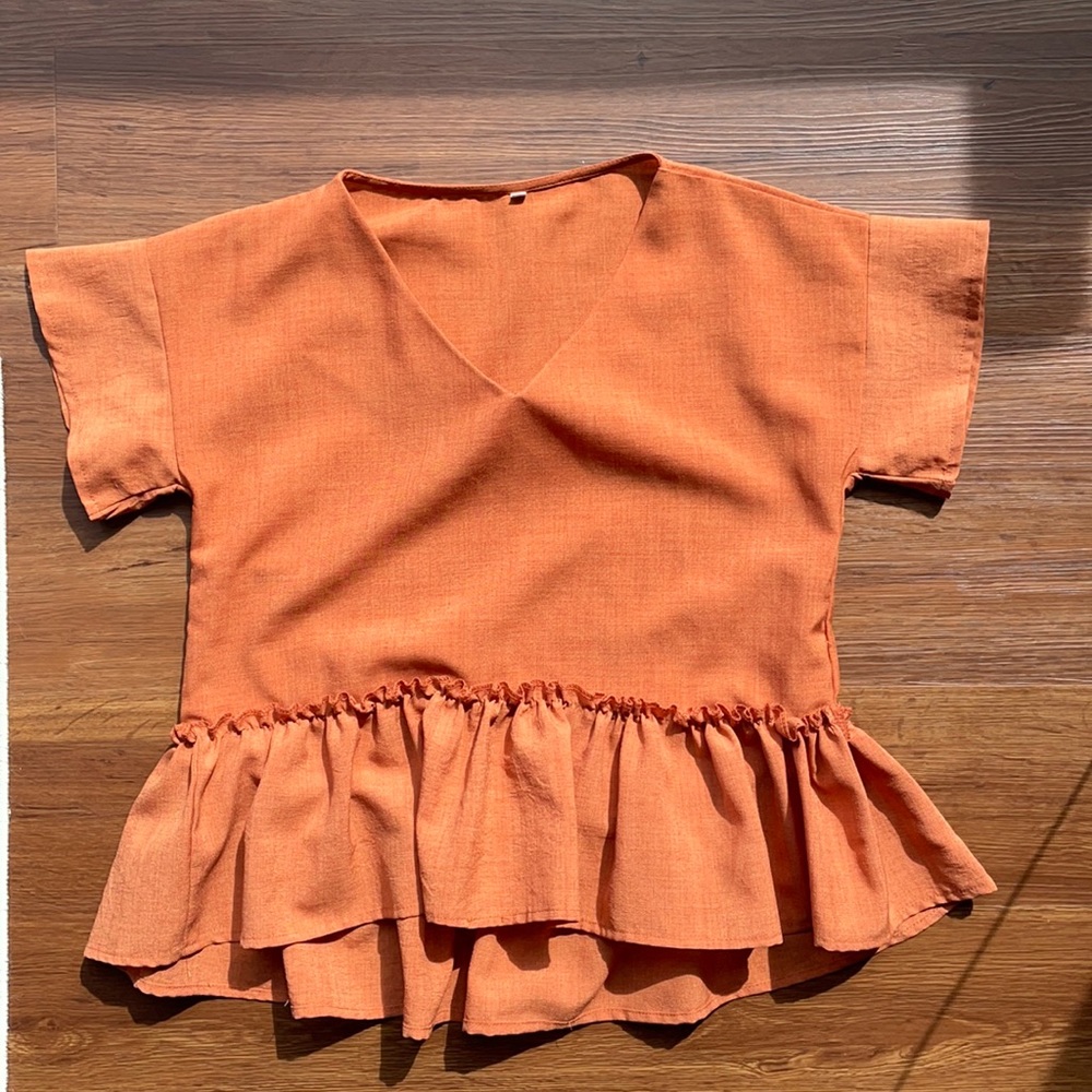 Orange peplum shirt